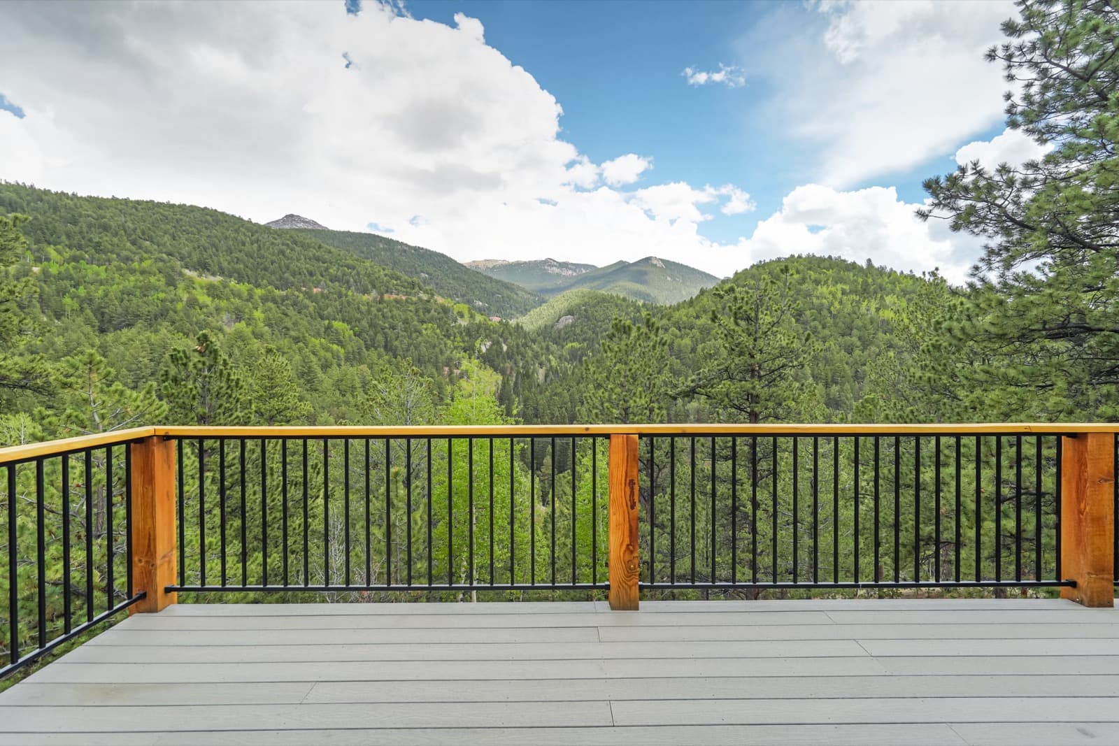 Mountain deck view from a Renjoy cabin