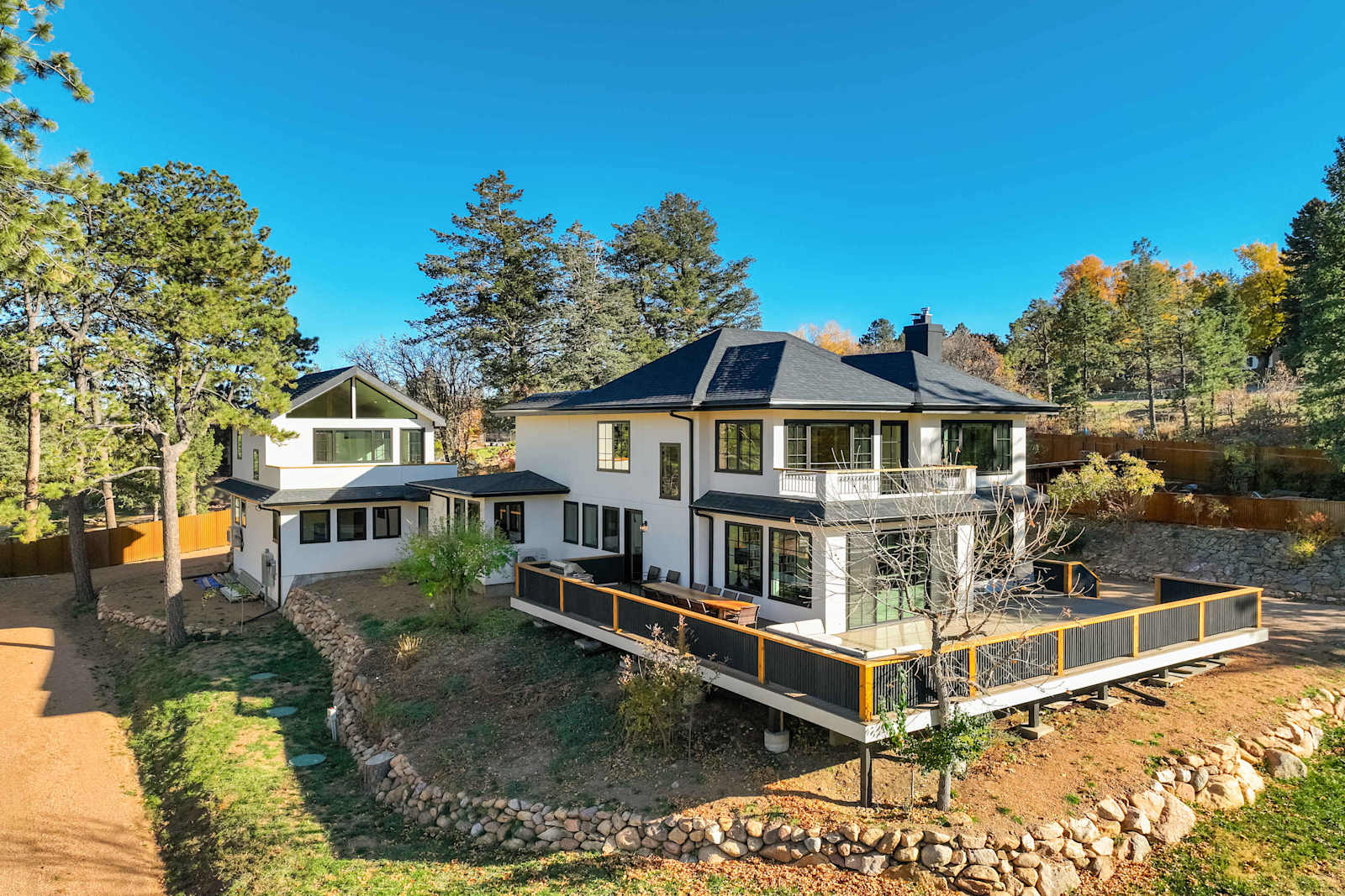 Welcome to The Mesa House! Tucked among soaring pines near the Broadmoor, this newly built retreat offers a peaceful mountain escape with stunning natural scenery and modern design that feels instantly inviting.